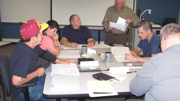 a group of people sitting around a table